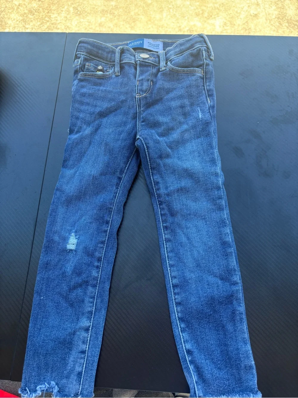 Assorted lot of five pairs of jeans, all size 4